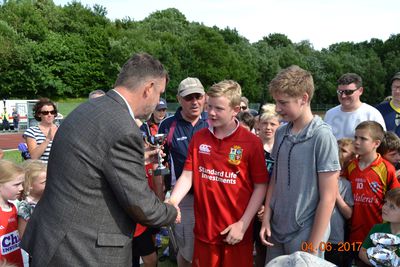 Irish Ambassador presenting winnning cup to U12-U15